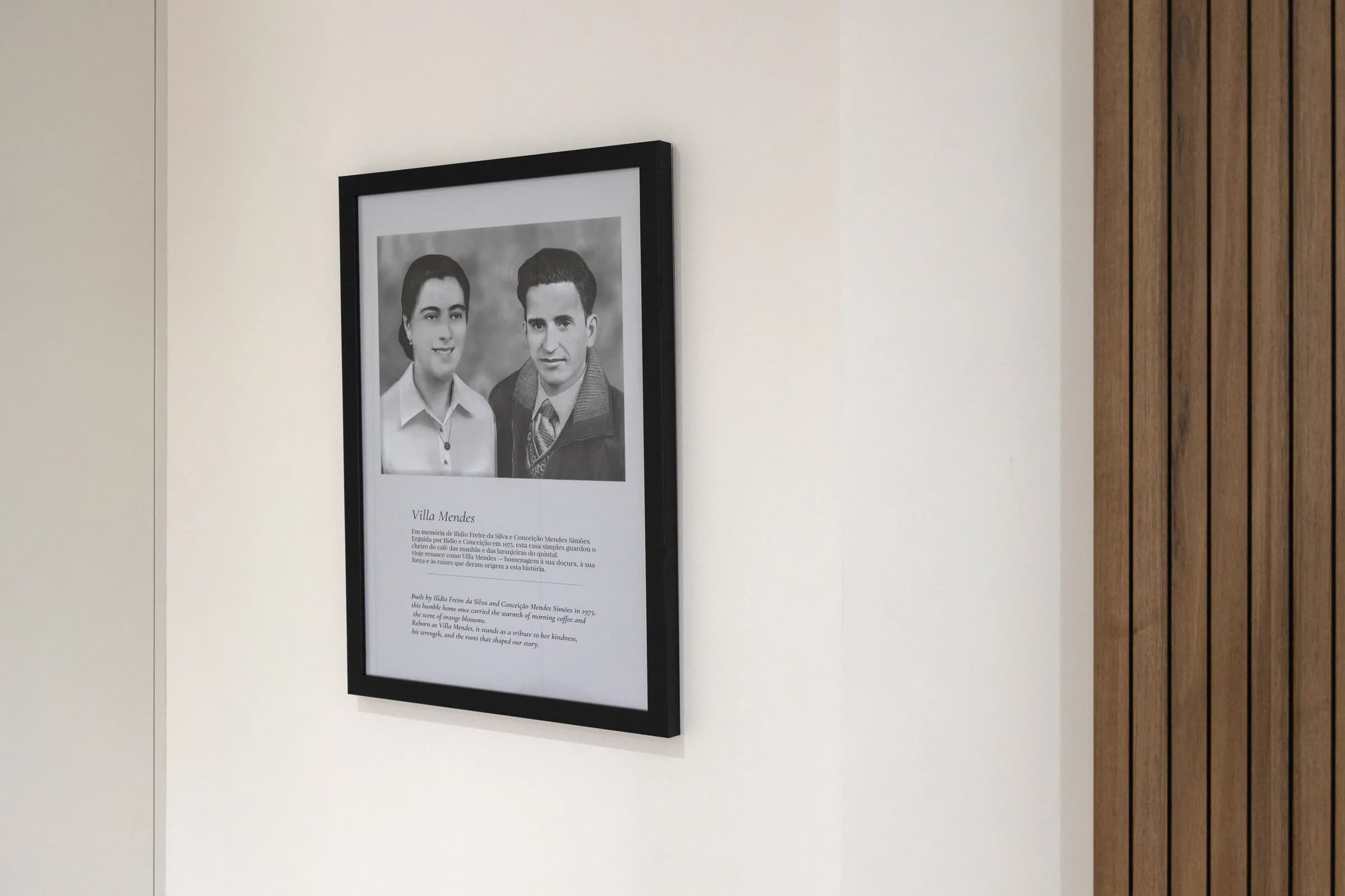 Ilídio and Conceição, who built the house in 1975, framed in the hallway