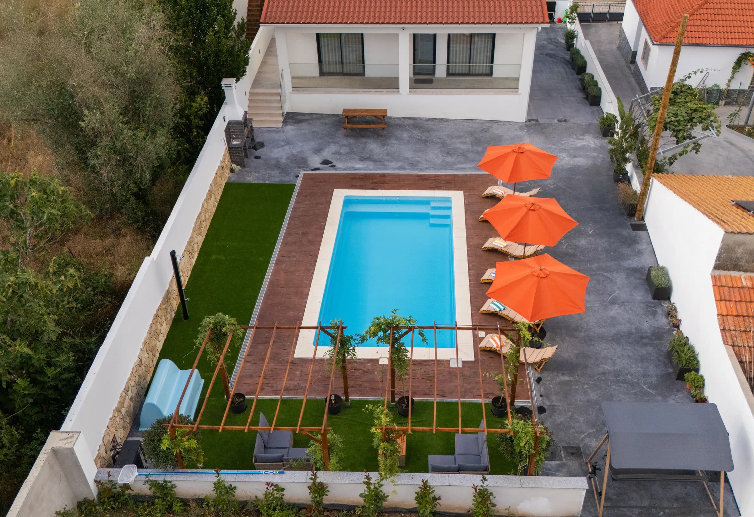 Aerial view of the pool, sun terrace and garden at Villa Mendes