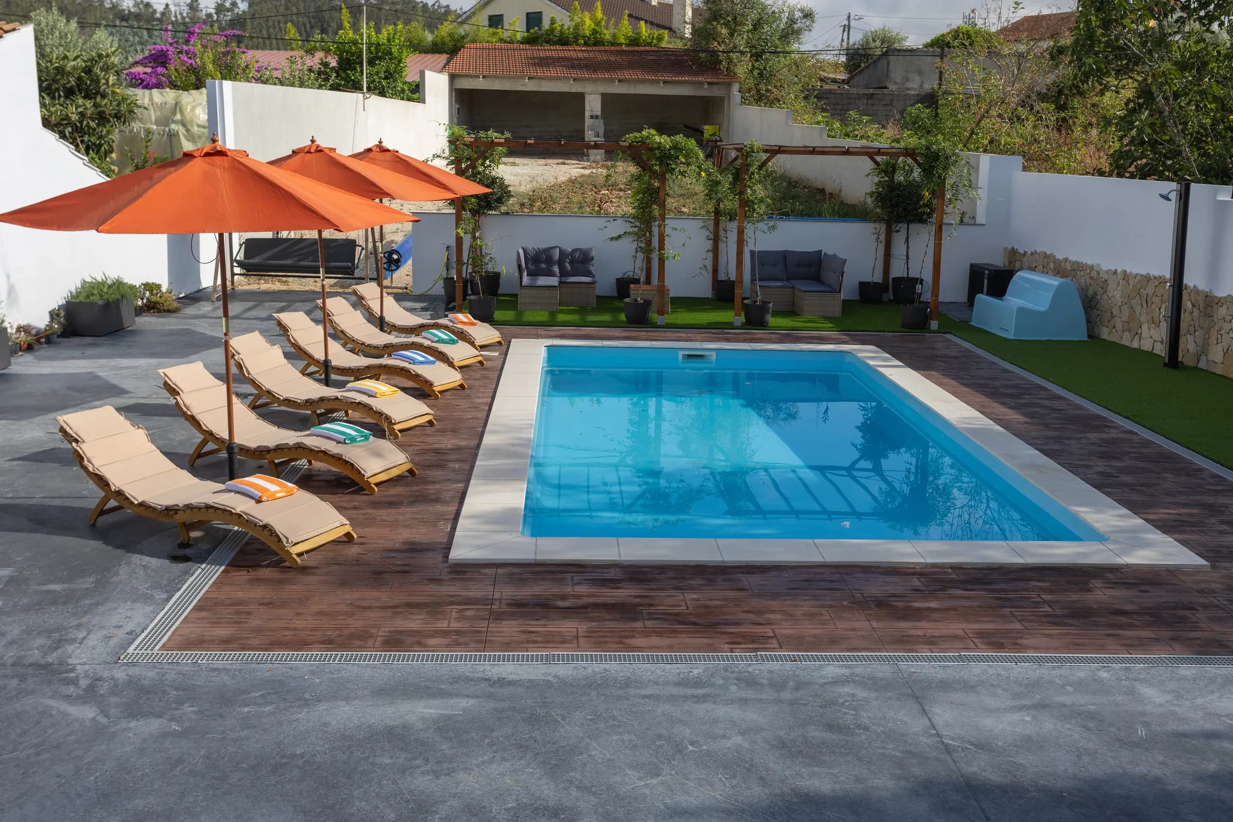 Sun loungers lined up along the pool
