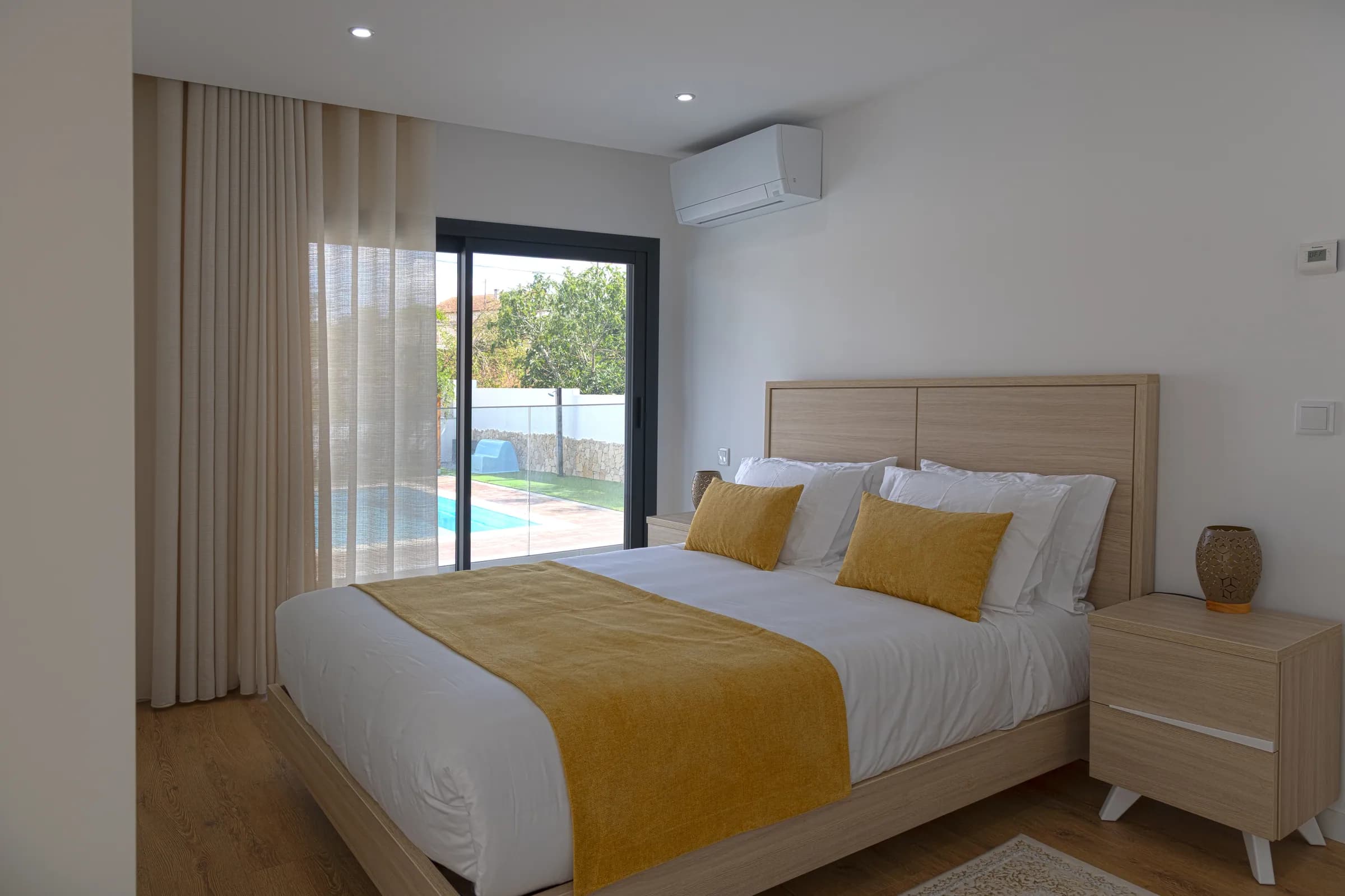 Double bedroom with sliding doors onto the pool terrace